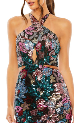 Woman wearing the Mac Duggal 49695 Multicolor Sequin Formal Dress, a halter neck gown featuring vibrant floral patterns and front cut-out details.