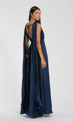 A woman wearing a Sage Green Long Formal Dress (Mac Duggal 49716) with elegant details stands against a plain light background.