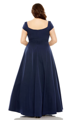 A woman with long brown hair is seen from the back, wearing the Mac Duggal Plus-Size Simple Long Formal Dress 49783W, a floor-length navy blue A-line gown with cap sleeves.