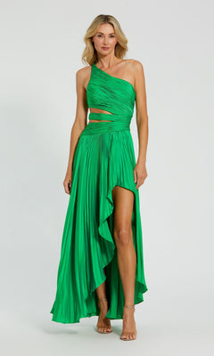 A woman wears the Mac Duggal 49837 High-Low Pleated Formal Dress, featuring a bright green color, cut-out one-shoulder design, pleats, and a high-low hem, as she stands against a plain background.