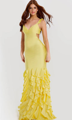 A woman stands against a plain light background wearing the yellow Long Prom Dress: Jovani 49897, featuring a sleeveless stretch-jersey design and a ruffle tiered skirt.