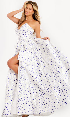 A woman poses in the Jovani 49899 Long Prom Dress in Off White/Royal, featuring a strapless polka dot design with a layered ruffle bodice, high slit, and voluminous satin A-line skirt—a playful twist on a classic look.