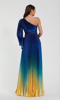 A woman faces away, wearing the Mac Duggal 49903 One-Shoulder Ombre Formal Dress—a pleated long dress that fades from blue at the top to green and yellow at the hem.