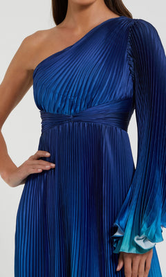 A person wearing the Mac Duggal 49903: One-Shoulder Ombre Formal Dress with pleats and a long right sleeve, styled as an evening gown.