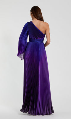 A woman stands with her back to the camera in a Mac Duggal 49903 One-Shoulder Ombre Formal Dress, featuring floor-length pleats in purple and blue against a plain background.