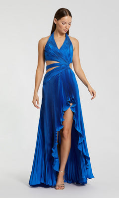 A woman wears the Long Formal Dress: Mac Duggal 49995, a sleeveless, halter-neck cobalt pleated charmeuse gown featuring cutout waist details and a high-low ruffled hem.