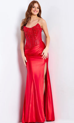 A woman stands against a white background wearing the Jovani 50012 Lace-Corset Strapless Prom Gown in red—a floor-length dress featuring a thigh-high slit and beaded bodice embellishments.