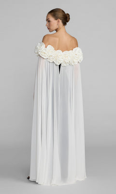 Woman wearing the Mac Duggal 50041 long formal dress, an off-the-shoulder crepe gown decorated with large fabric flowers along the neckline, standing against a plain background and facing away.