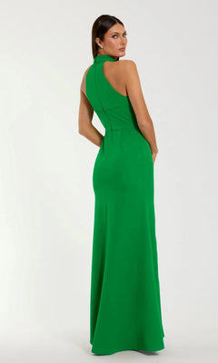 A woman faces away in a High-Neck Long Blue Formal Dress (Mac Duggal 50053) with a fitted waist and sleeveless design, standing against a plain light background.