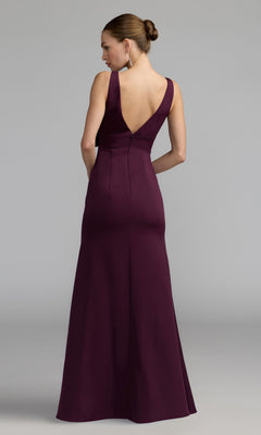Woman wearing the Mac Duggal 50087 Bow-Front Green Formal Dress, sleeveless and floor-length, with her back to the camera against a plain gray background.