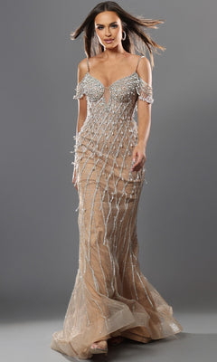 A woman wearing the Jovani 50202 long formal dress featuring nude-colored fabric with silver beadwork and off-the-shoulder straps, standing against a gray background.