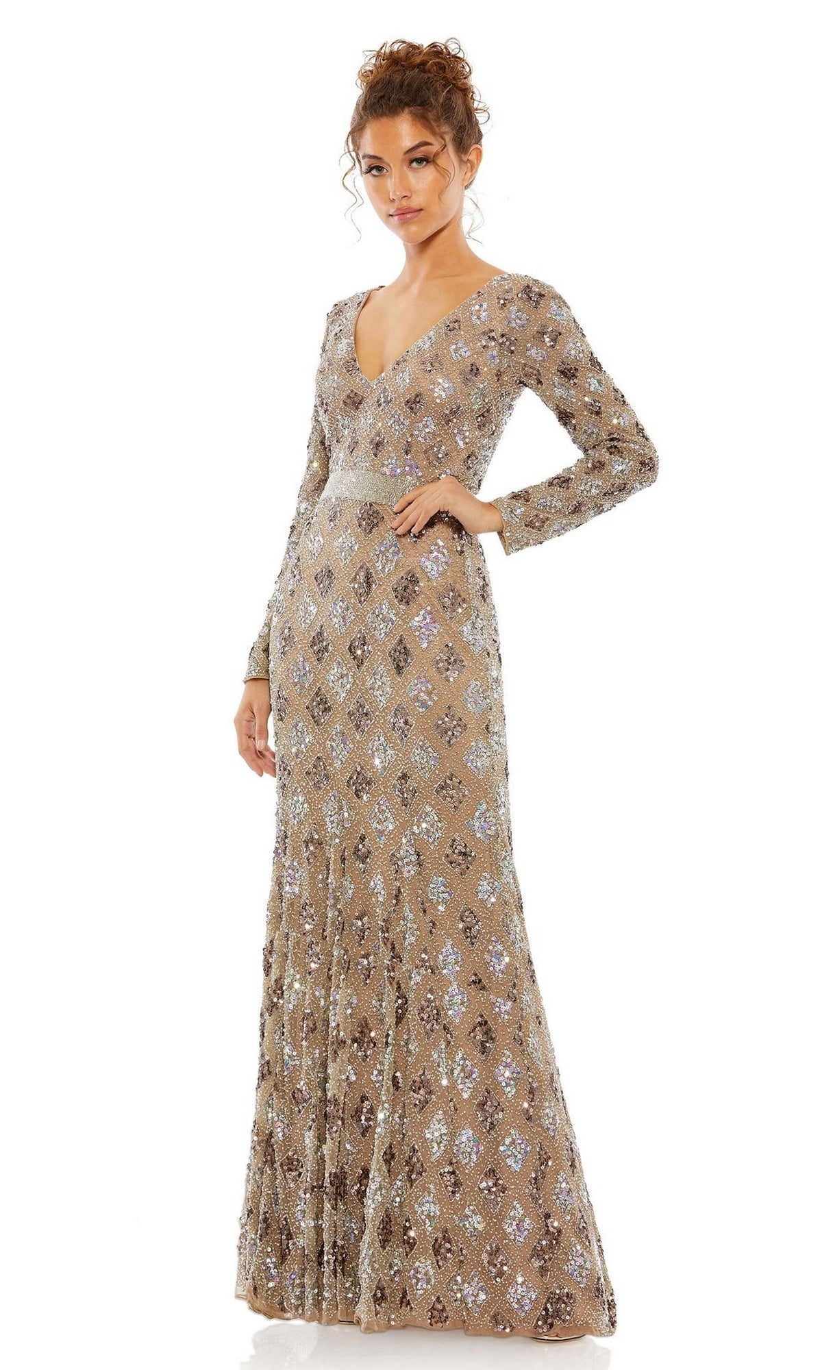 A woman faces forward in the Mac Duggal 5021 Long Sleeve Beaded Formal Dress, a floor-length beige gown with silver sequin diamond patterns, set against a white background. Perfect as an elegant mother of the bride dress.