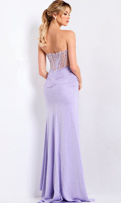 A woman wearing the Jovani 50238 long prom dress in lavender, with a strapless beaded corset bodice and sheer back panel, stands against a white background.
