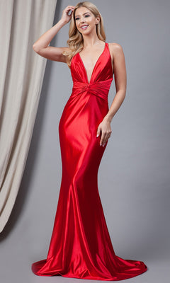 A woman in a Twist-Waist Deep V-Neck Long Prom Dress 5039—sleeveless, floor-length, red satin with a deep V-neckline—stands before a gray backdrop.