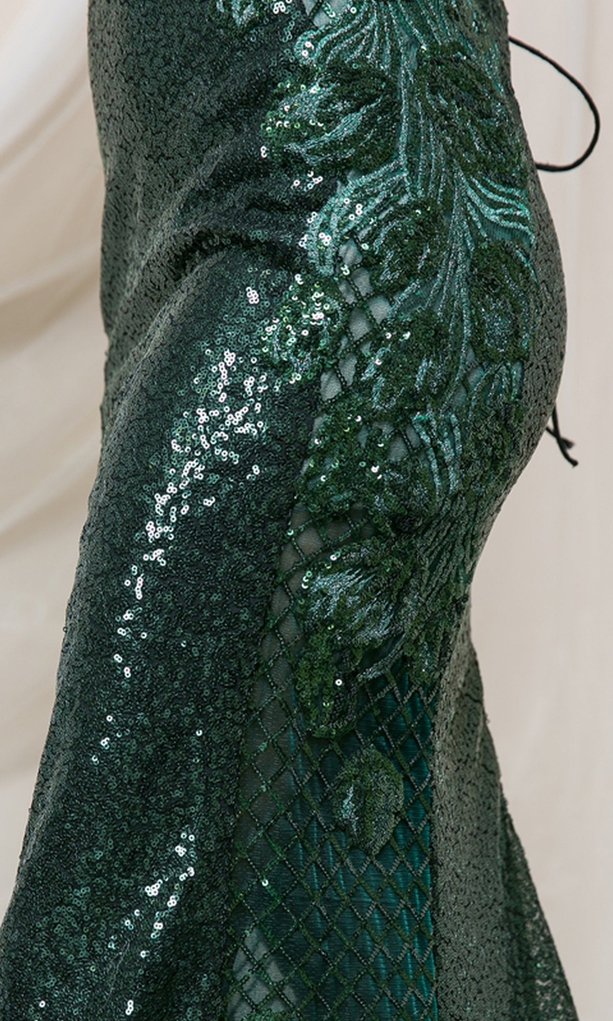 Close-up of the Corset-Back High-Neck Long Sequin Prom Dress 5043 in dark green, featuring ornate embroidery, a mesh diamond design, and a fitted silhouette—an elegant yet affordable prom dress option.