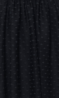 Close-up of black fabric with a gathered texture and evenly spaced dotted pattern, featured on the Off-Shoulder Short Black Homecoming Dress 5054BN—an affordable choice for cocktail parties or homecoming.