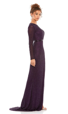 A woman in profile models the Long Formal Dress 5056 by Mac Duggal—a floor-length, dark purple gown with long sleeves, subtle shimmer, and a small train—set against a plain white background.
