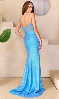 Woman modeling the back of a turquoise blue evening gown with allover sequins in an indoor setting.