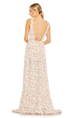 Woman wearing the Mac Duggal 50659 Floral-Print Maxi Party Dress, a long, sleeveless, open-back dress with ruffles and light pink and green floral patterns, standing with her back to the camera.