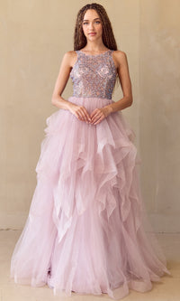 Woman wearing a rose pink ball gown with a beaded top against a beige background