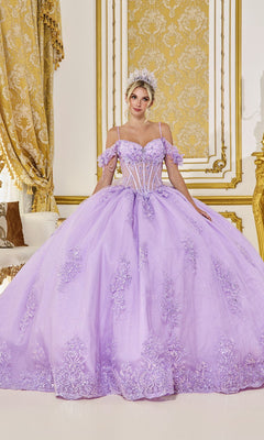 A woman in the Quinceanera Dress 5093 by Dancing Queen, in lilac with floral embroidery and a tiara, stands in an ornate room with gold and white decor.