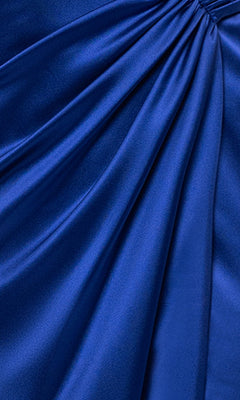 Close-up of the Long Stretch Satin Prom Dress: Blondie Nites 5119N in royal blue, featuring stretch satin fabric with gathered, draped folds for a textured, shiny surface.