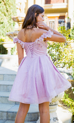 A woman stands on outdoor steps wearing the Shimmer Off-Shoulder Short Homecoming Dress 5120J in light pink with floral details and a corset back, perfect for parties.