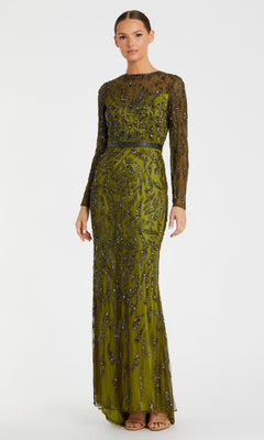 A woman stands against a plain white background wearing the Mac Duggal 5124 Long Sleeve Sequin Formal Dress, an olive green modest evening gown adorned with intricate beaded embellishments.