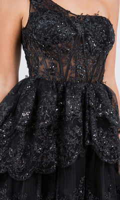 Close-up of the One-Shoulder Short Tiered Homecoming Dress 5132J in black, featuring lace and sequin embellishments, a semi-sheer fabric, and a layered ruffled skirt—an ideal sequin party dress for any semi-formal occasion.