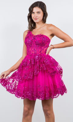 Woman wearing the One-Shoulder Short Tiered Homecoming Dress 5132J, featuring a bright pink sequin design, one-shoulder neckline, and short flared skirt, standing against a plain background.