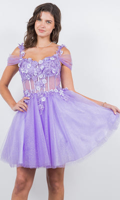 A young woman poses against a plain white background wearing the Embellished Short Glitter-Tulle Homecoming Dress, a sparkly lilac off-shoulder fit-and-flare style with floral appliqué details.