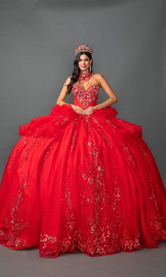 A woman poses against a gray backdrop wearing the Quinceanera Dress 5159 By Dancing Queen, a luxurious strapless red ball gown featuring gold-accented, layered ruffle skirt, a beaded corset bodice, and accessorized with a matching choker, gloves, and jeweled crown.