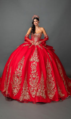 A woman stands against a plain grey background wearing the Quinceanera Dress 5161 by Dancing Queen in red—a strapless ballgown adorned with gold embroidered appliques—paired with elegant red gloves and a matching red tiara.