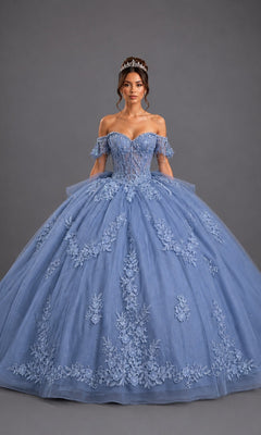 A woman wearing the Quinceanera Dress 5171 By Dancing Queen in dusty blue, featuring off-shoulder floral lace detailing and a tiara, stands against a plain gray background.