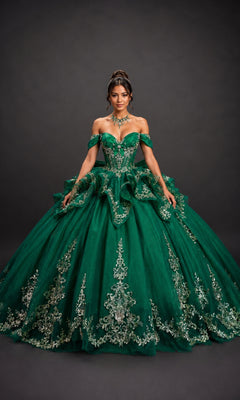 A woman wearing the Quinceanera Dress 5198 by Dancing Queen in hunter green—an elaborate ball gown featuring a corset bodice, off-the-shoulder sleeves, and silver floral embroidery—stands against a plain dark background.