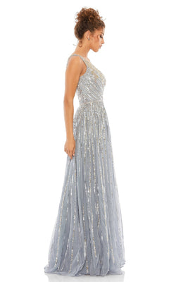 Woman in a Mac Duggal 5220 One-Shoulder Beaded Formal Dress stands in profile against a white background.