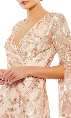 A woman wearing the Long Formal Dress 5222 by Mac Duggal, featuring a peach-colored sequin beaded design, V-neckline, and three-quarter sleeves, shown from shoulders to hips.