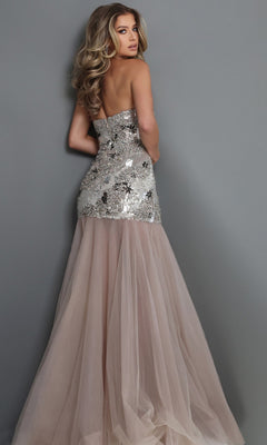 Model faces away, wearing the Jovani 52538 long formal dress, featuring a strapless sequined bodice embellished with delicate crystal beadwork and a flowing blush tulle skirt, set against a plain gray background.