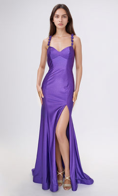 A woman models the Nina Canacci 5304, a sleeveless, backless purple formal gown with a thigh-high slit and strappy high heels, standing against a plain light background.