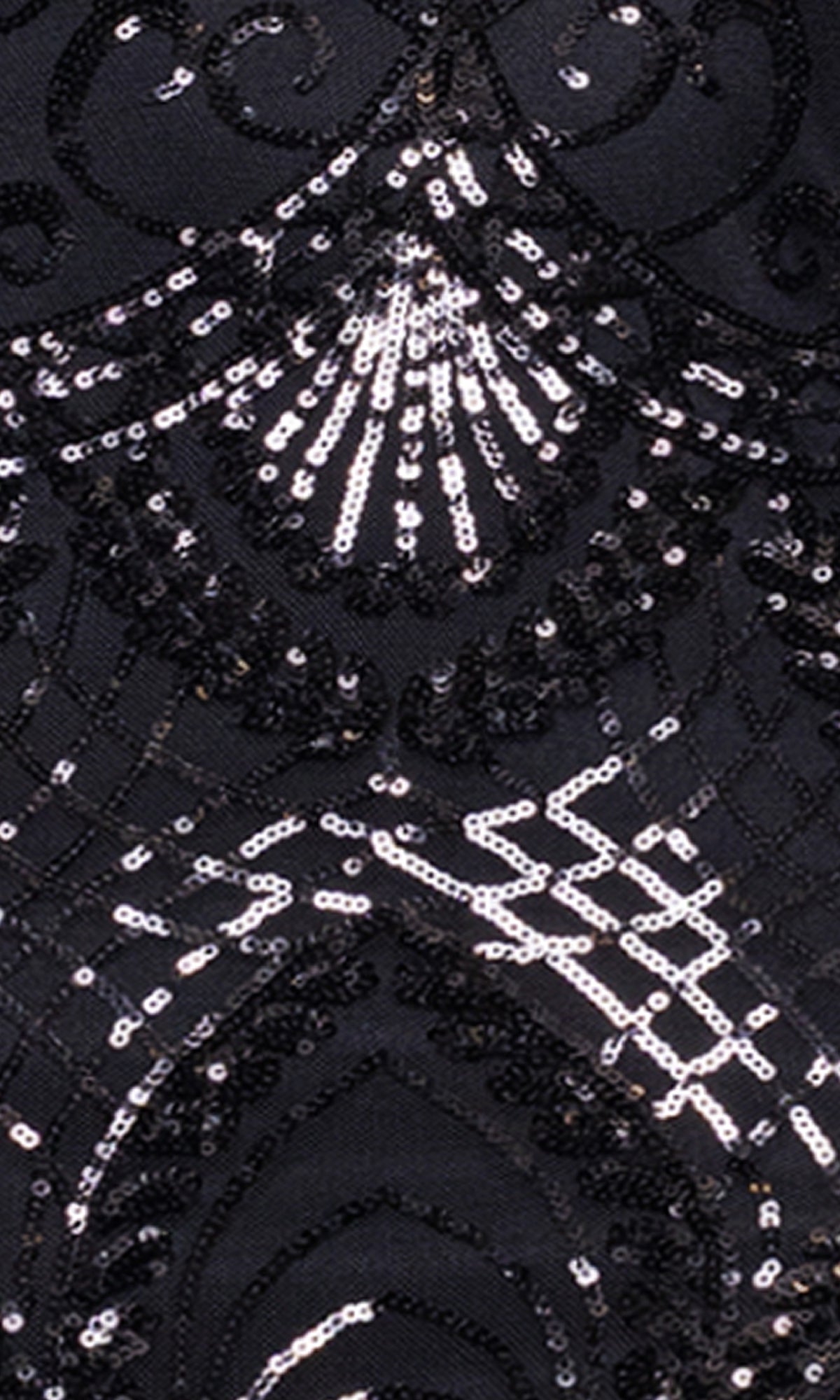 Close-up of black fabric from the Blondie Nites 5327BN Long Black Sequin Prom Dress, showcasing an affordable design with black and silver sequins in intricate, symmetrical curved patterns.