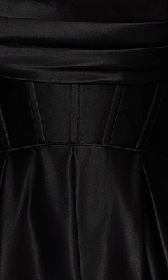 Close-up of the Long Black A-Line Prom Dress: Blondie Nites 5333BN in satin, featuring pleated and panel seam details at the waist.
