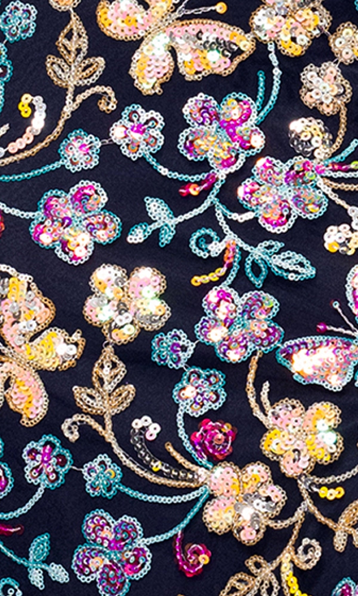 Close-up of colorful sequin embroidery with flowers and butterflies on dark fabric, similar to the Sequin Butterfly Prom Gown: Blondie Nites 5402BN.