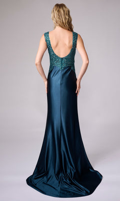 A woman faces away in the Nina Canacci 5411, a dark teal sleeveless formal gown that's floor-length with a low back and an embellished lace-detailed bodice.