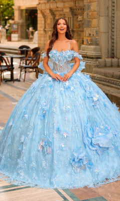 A woman stands outdoors in the Amarra 54233 3D Flower Quinceanera Dress, a voluminous light blue ball gown adorned with lace, 3D flowers, and elegant floral details.