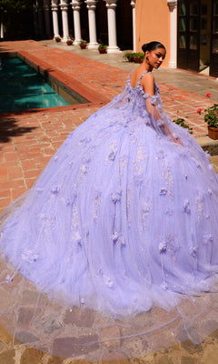 A young woman in the Amarra 54254 Periwinkle Purple Quincea¤era Dress with floral details stands by a brick patio and pool, looking over her shoulder.
