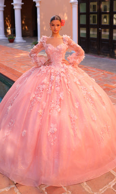 A young woman poses outdoors near a tiled courtyard and white columns in the Corset Ball Gown Quinceañera Dress 59290 by Amarra, featuring glitter tulle, long sleeves, and a full skirt.