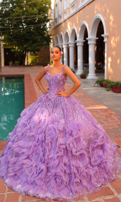 Wearing the Quinceanera Dress 54314 by Amarra, a young woman poses by a pool in an elaborate lavender v-neck ball gown with floral details and a sheer cape train, her hands resting on her hips.