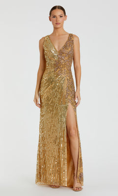 A woman stands against a plain white background in the Mac Duggal 5473 Sleeveless Beaded Formal Dress, a gold floor-length gown featuring sequin details, a V-neckline, and a high side slit.