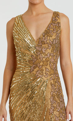 A woman wears the Mac Duggal 5473 Sleeveless Beaded Formal Dress featuring gold sequins, floral embroidery, and a deep V neckline.