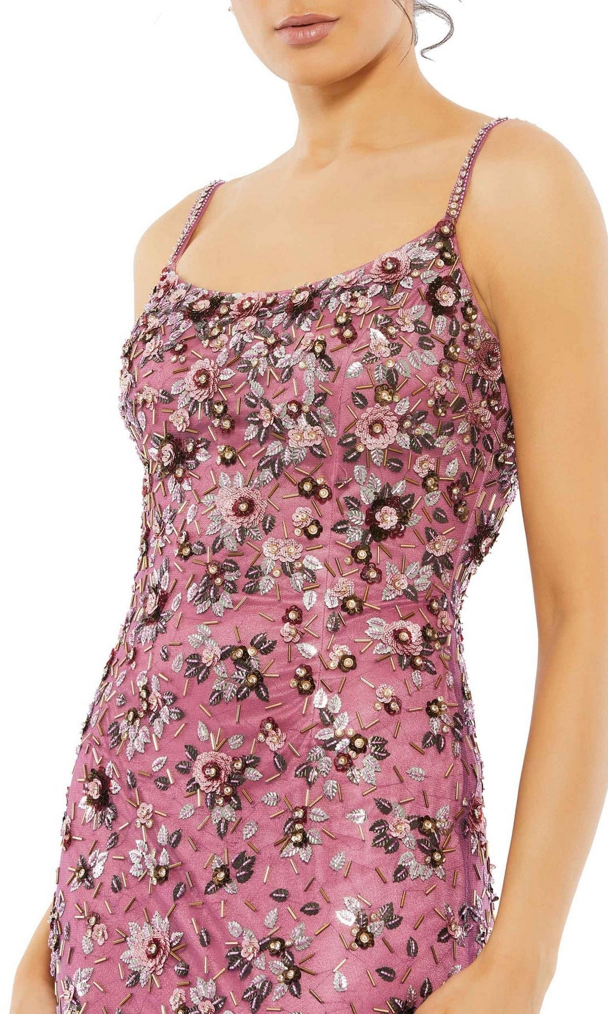 A woman wears the Floral-Beaded Long Formal Dress: Mac Duggal 5477—a sleeveless pink gown with thin straps and colorful floral embroidery.